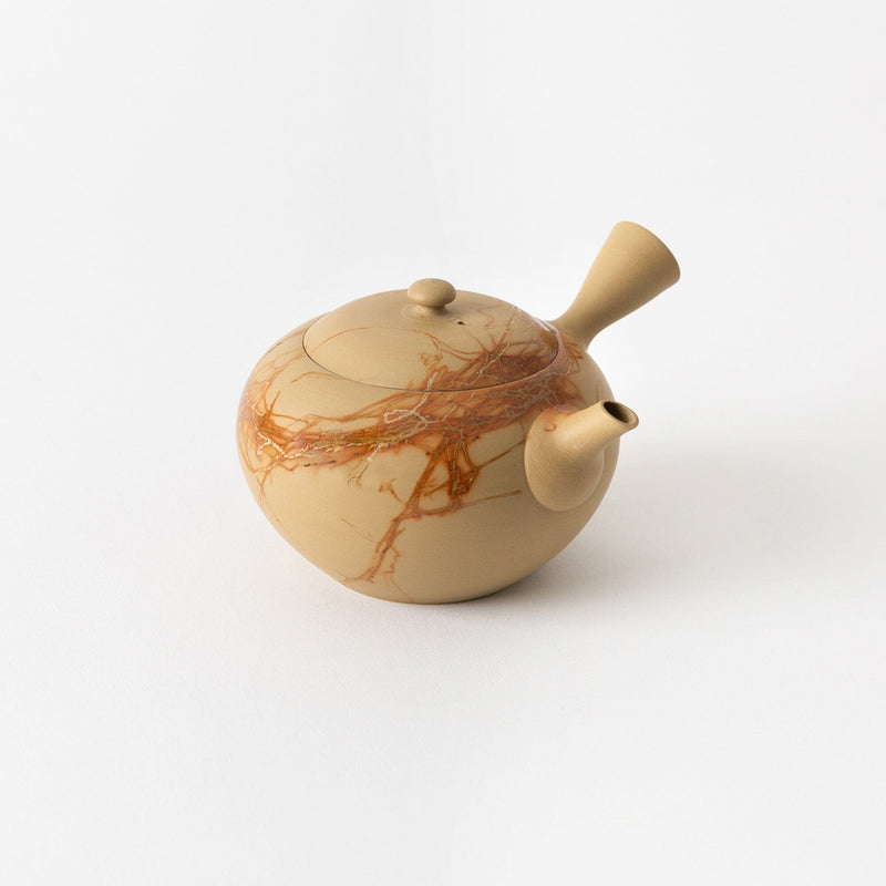 A limited-edition Tokoname Kyusu by Chato Co., Ltd.—a beige ceramic teapot with round body, side handle, lid, spout, and reddish-brown marbled patterns on a plain white background.